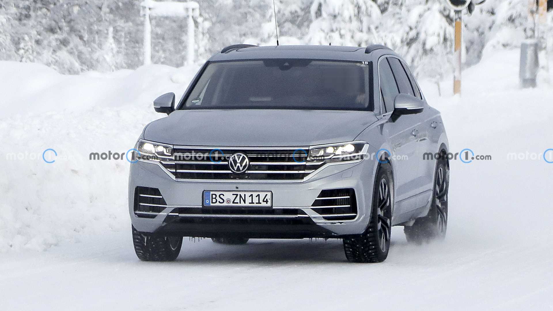 Volkswagen Touareg prototype hides its new style with stickers in new spy images